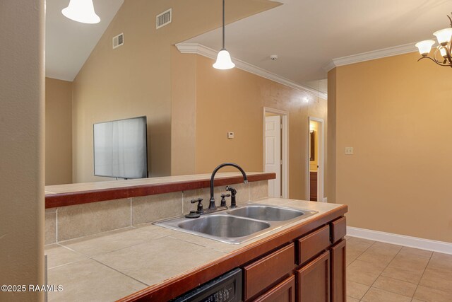 111 Bottle Brush Ln, Carencro, LA 70520 - kitchen with a sink, hanging light fixtures, tile countertops, and visible vents