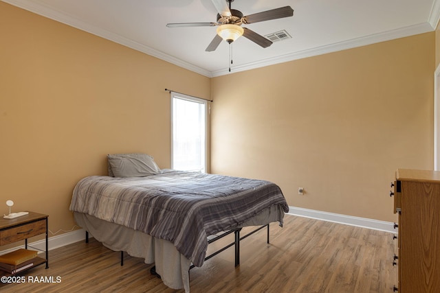 111 Bottle Brush Ln, Carencro, LA 70520 - bedroom featuring visible vents, ornamental molding, wood finished floors, baseboards, and ceiling fan