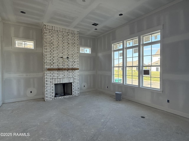unfurnished living room with baseboards and a brick fireplace