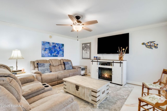 112 Hillside Dr Unit 3, Lafayette, LA 70503 - living room featuring crown molding, baseboards, a ceiling fan, and a warm lit fireplace