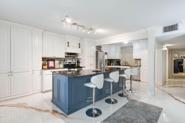 112 Hillside Dr Unit 3, Lafayette, LA 70503 - kitchen featuring a kitchen breakfast bar, white cabinetry, visible vents, and stainless steel appliances