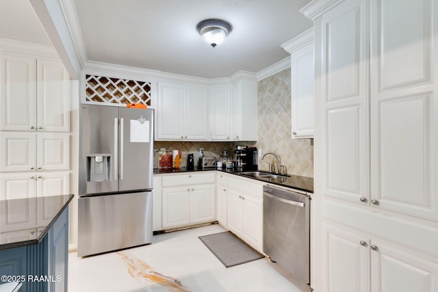 112 Hillside Dr Unit 3, Lafayette, LA 70503 - kitchen with a sink, white cabinets, tasteful backsplash, and stainless steel appliances