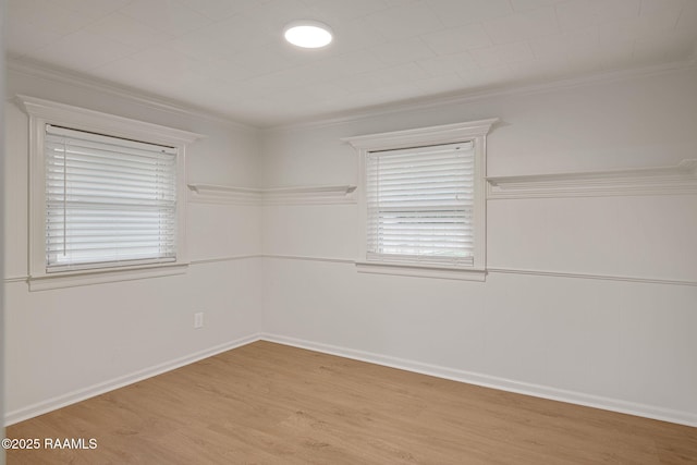 1013 Young St, Broussard, LA 70518 - empty room featuring crown molding, a healthy amount of sunlight, and wood finished floors