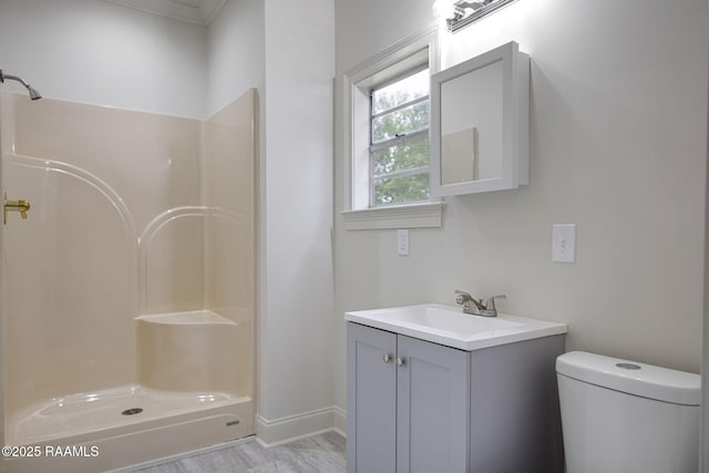 1013 Young St, Broussard, LA 70518 - full bathroom featuring crown molding, vanity, a shower, baseboards, and toilet