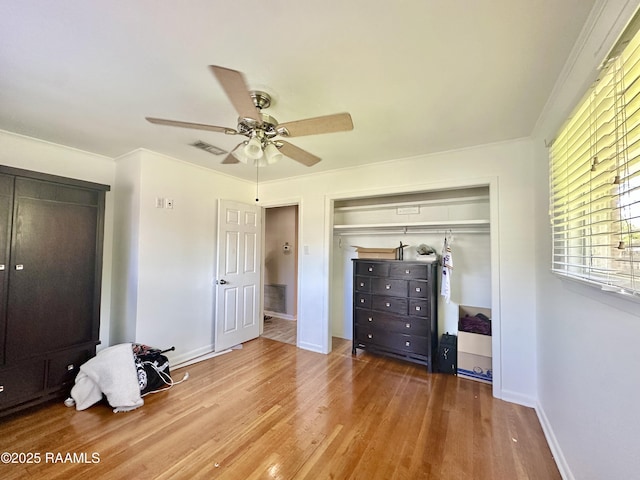 820 Genevieve Dr, Lafayette, LA 70503 - bedroom with wood finished floors, a closet, ceiling fan, baseboards, and visible vents
