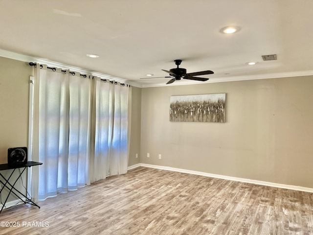 820 Genevieve Dr, Lafayette, LA 70503 - unfurnished room featuring crown molding, visible vents, ceiling fan, and wood finished floors