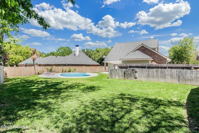 view of yard featuring a fenced backyard