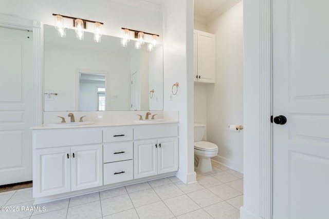 full bathroom featuring a sink, tile patterned floors, crown molding, and toilet