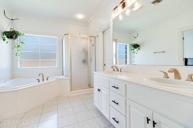 bathroom with a sink, a shower stall, and a garden tub