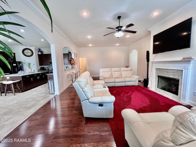 1935 Heberts Pass, Lake Charles, LA 70607 - living area featuring ornamental molding, recessed lighting, a ceiling fan, arched walkways, and wood finished floors
