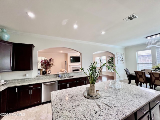 1935 Heberts Pass, Lake Charles, LA 70607 - kitchen with crown molding, visible vents, stainless steel dishwasher, arched walkways, and a sink