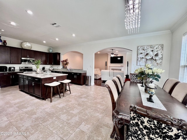 1935 Heberts Pass, Lake Charles, LA 70607 - dining area with recessed lighting, arched walkways, visible vents, and ornamental molding