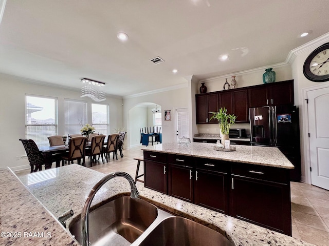 1935 Heberts Pass, Lake Charles, LA 70607 - kitchen with crown molding, arched walkways, visible vents, a center island, and a sink