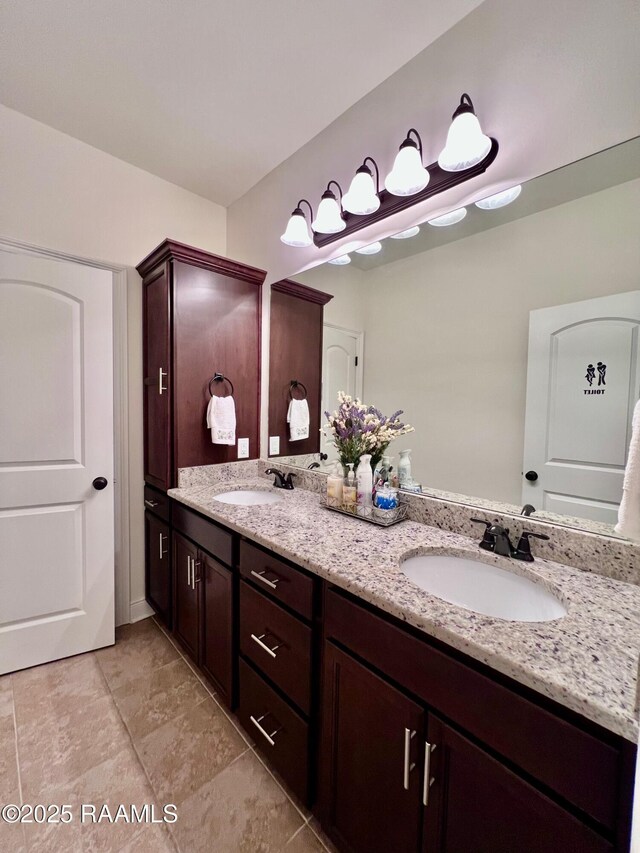 1935 Heberts Pass, Lake Charles, LA 70607 - full bathroom with tile patterned floors, double vanity, and a sink