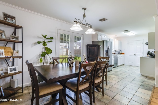dining room with crown molding, light tile patterned flooring, french doors, baseboards, and visible vents