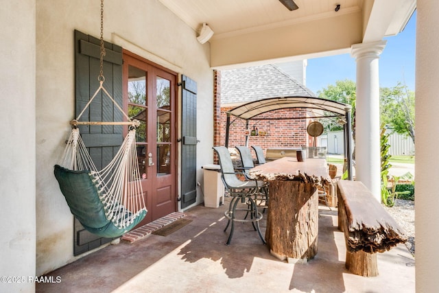 view of patio / terrace featuring a ceiling fan and french doors