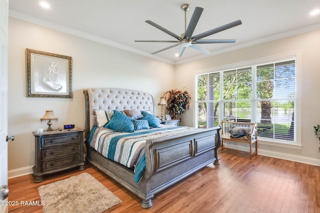 bedroom with recessed lighting, light wood finished floors, baseboards, and ornamental molding