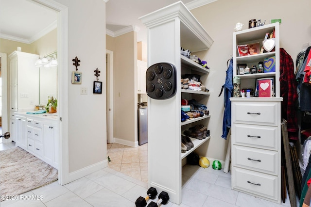 spacious closet featuring light tile patterned floors