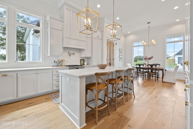 301 Greyford Dr, Lafayette, LA 70503 - kitchen featuring ornamental molding, a notable chandelier, light wood finished floors, and recessed lighting