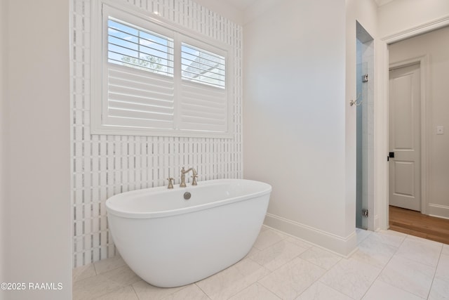 301 Greyford Dr, Lafayette, LA 70503 - bathroom with baseboards, a freestanding bath, and a stall shower