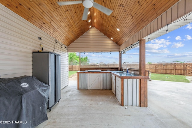 view of patio featuring a sink, a fenced backyard, a grill, area for grilling, and ceiling fan