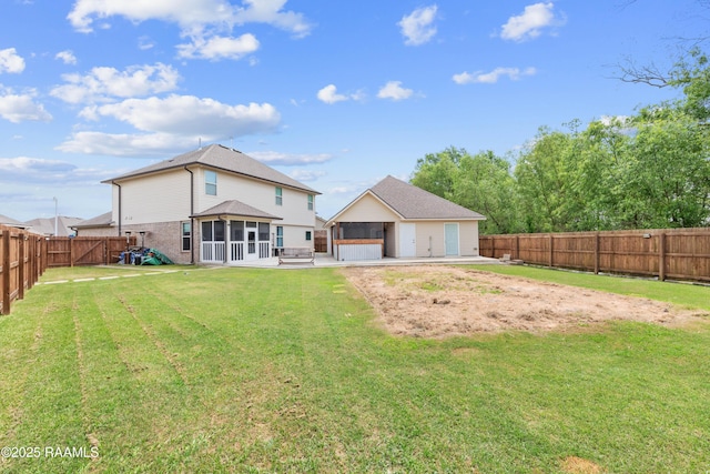 back of property with a fenced backyard, a sunroom, a yard, and a patio