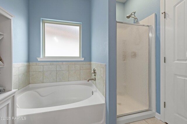 full bath with a garden tub and a stall shower