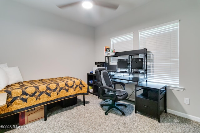 carpeted bedroom with ceiling fan and baseboards