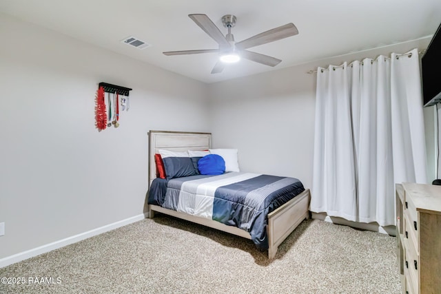 bedroom featuring baseboards, a ceiling fan, visible vents, and carpet