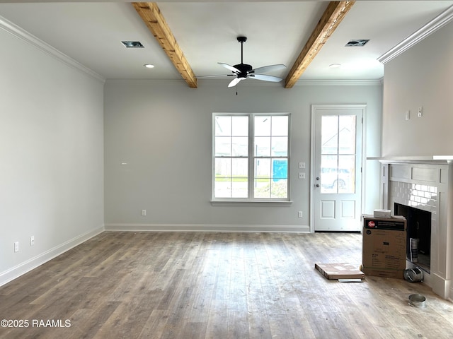 305 Bennington Ln, Youngsville, LA 70592 - unfurnished living room with a ceiling fan, beam ceiling, wood finished floors, a fireplace, and crown molding