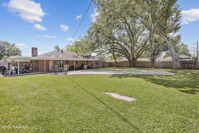 view of yard featuring a fenced backyard and a patio area