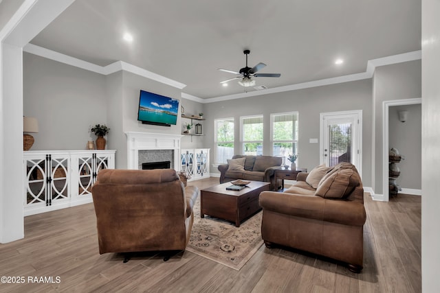 113 Spider Lily Ln, Lafayette, LA 70508 - living room featuring recessed lighting, a ceiling fan, wood finished floors, crown molding, and a fireplace