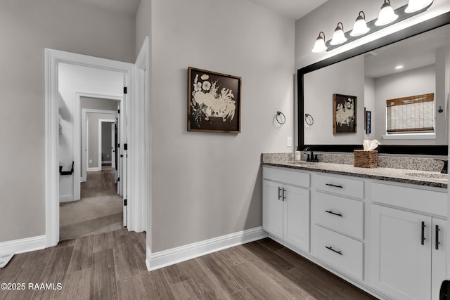 113 Spider Lily Ln, Lafayette, LA 70508 - bathroom with wood finished floors, baseboards, a sink, and double vanity