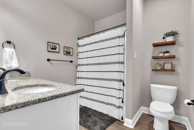 113 Spider Lily Ln, Lafayette, LA 70508 - bathroom with baseboards, wood finished floors, a shower with shower curtain, and toilet