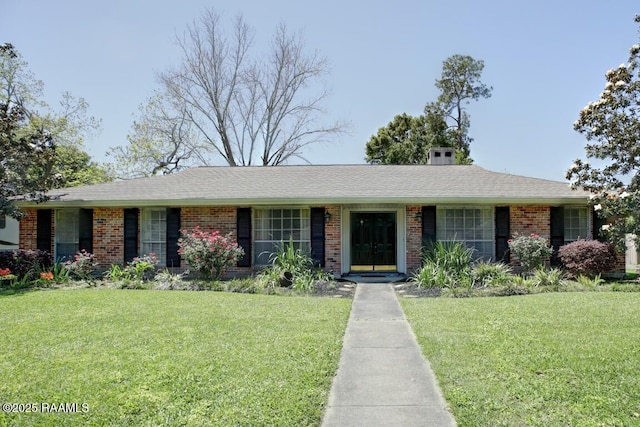 304 Broadmoor Blvd, Lafayette, LA 70503 - view of front of house featuring brick siding, a shingled roof, and a front lawn