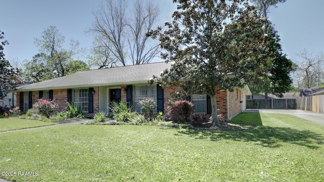304 Broadmoor Blvd, Lafayette, LA 70503 - ranch-style home with brick siding, fence, and a front yard
