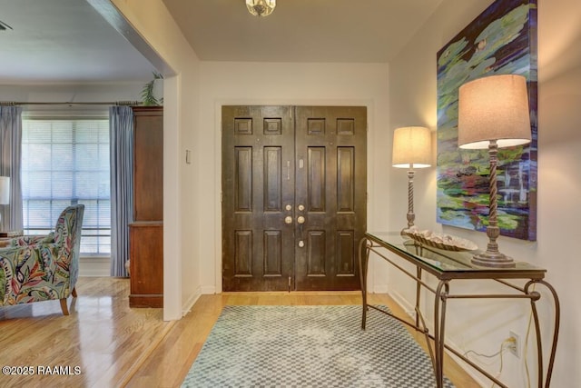 304 Broadmoor Blvd, Lafayette, LA 70503 - foyer featuring wood finished floors, visible vents, and baseboards