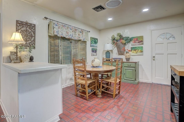 304 Broadmoor Blvd, Lafayette, LA 70503 - dining area featuring recessed lighting, brick floor, visible vents, and baseboards