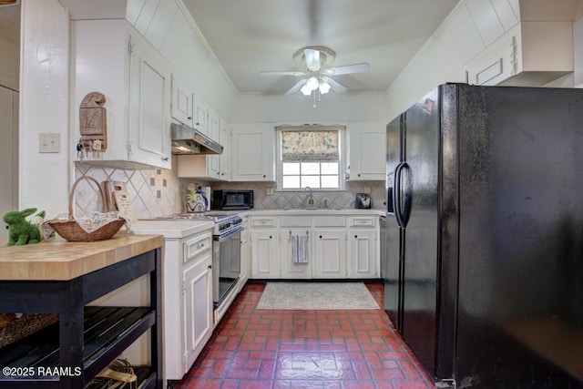 304 Broadmoor Blvd, Lafayette, LA 70503 - kitchen with a sink, brick floor, black appliances, light countertops, and under cabinet range hood