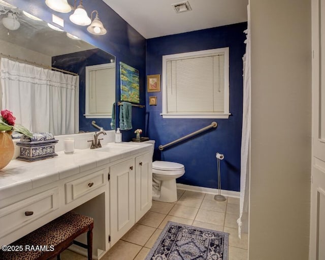 304 Broadmoor Blvd, Lafayette, LA 70503 - bathroom featuring visible vents, tile patterned flooring, vanity, and toilet