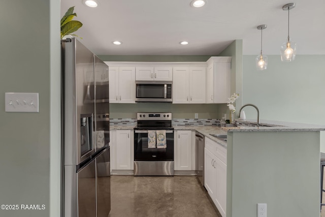 1612 Dehart Dr Unit A, New Iberia, LA 70560 - kitchen featuring stainless steel appliances, a peninsula, a sink, white cabinetry, and concrete flooring