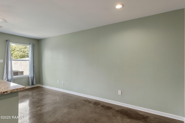 1612 Dehart Dr Unit A, New Iberia, LA 70560 - spare room with baseboards, concrete flooring, and recessed lighting
