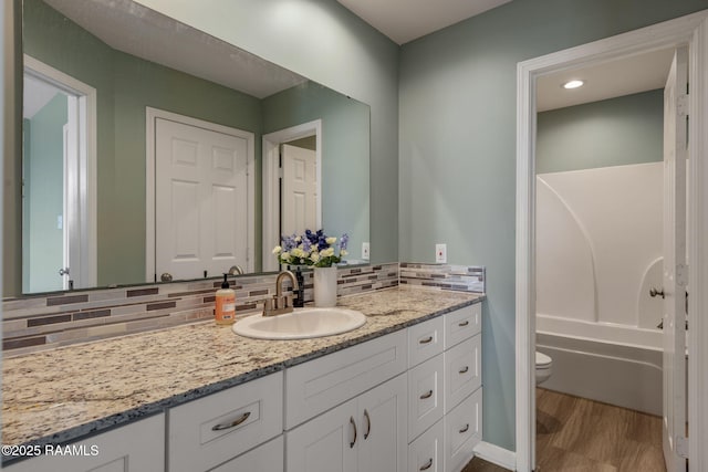 1612 Dehart Dr Unit A, New Iberia, LA 70560 - full bath with backsplash, toilet, vanity, and wood finished floors