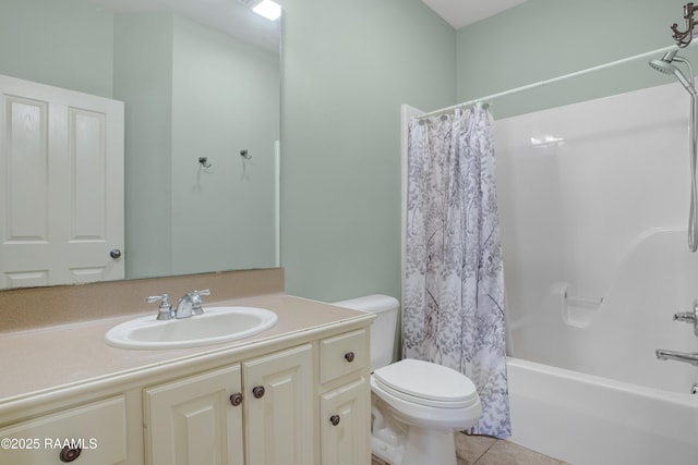 bathroom with vanity, shower / tub combo with curtain, tile patterned floors, and toilet