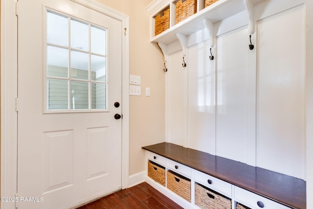 mudroom featuring baseboards and dark wood-style flooring