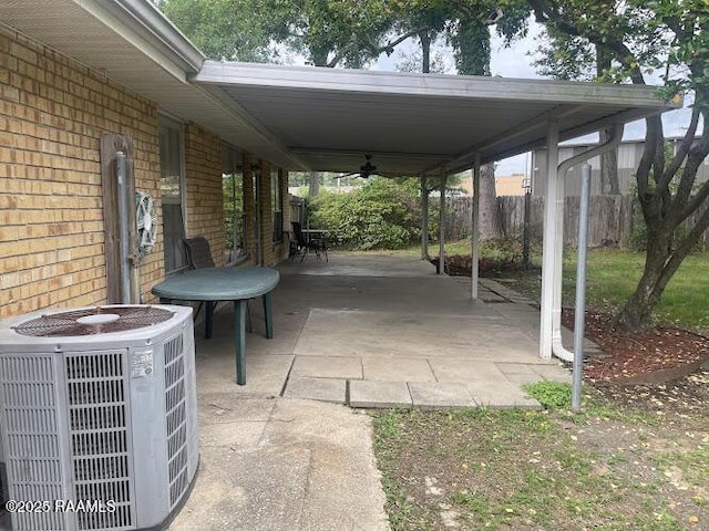 210 Essex St, Lafayette, LA 70506 - view of patio with a ceiling fan, central AC unit, and fence