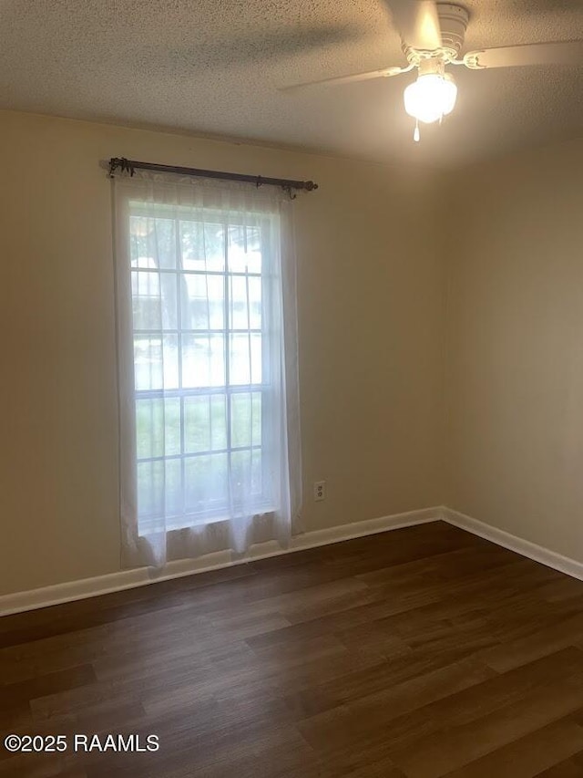 210 Essex St, Lafayette, LA 70506 - unfurnished room featuring baseboards, a ceiling fan, dark wood-style floors, and a textured ceiling
