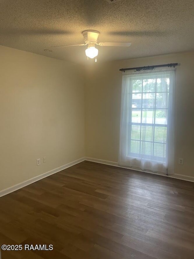 210 Essex St, Lafayette, LA 70506 - spare room featuring dark wood finished floors, a ceiling fan, and a textured ceiling