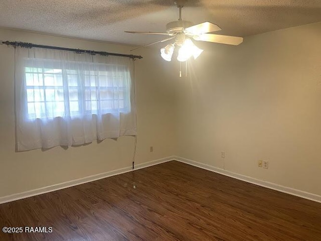 210 Essex St, Lafayette, LA 70506 - empty room with baseboards, a ceiling fan, dark wood-style floors, and a textured ceiling
