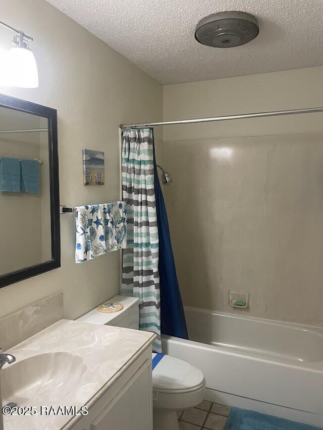 210 Essex St, Lafayette, LA 70506 - bathroom featuring shower / tub combo with curtain, a textured ceiling, tile patterned flooring, and toilet